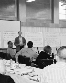 Scholars discuss research ideas at a Tobin Project conference
